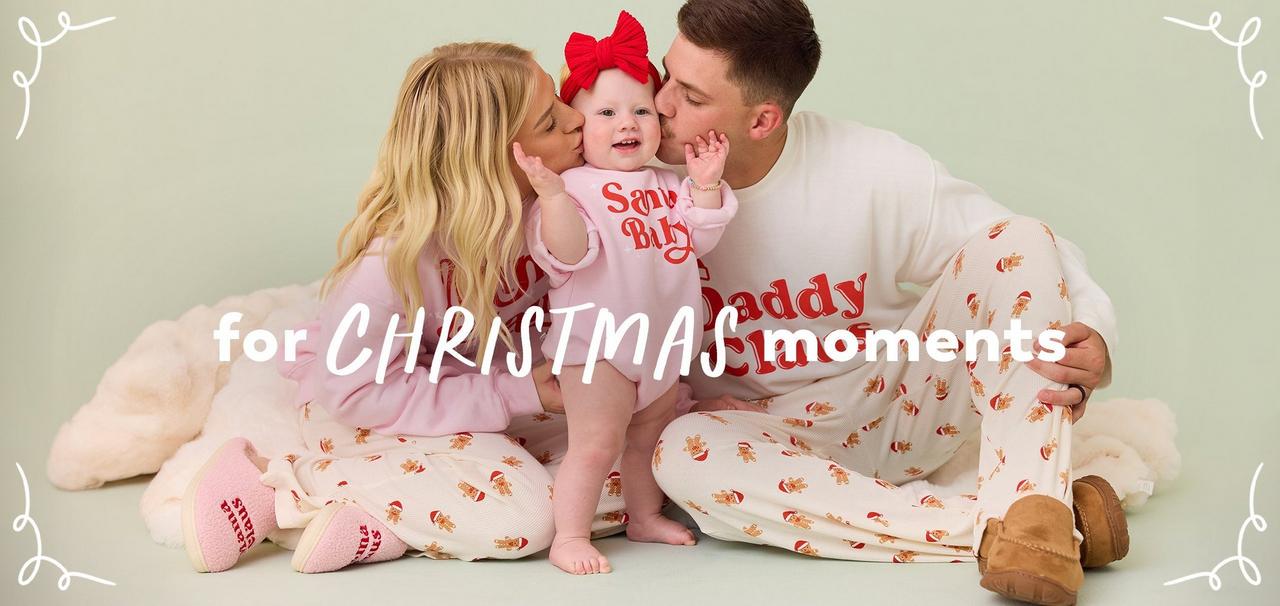 mom, dad, and little girl wearing coordinating christmas pajamas