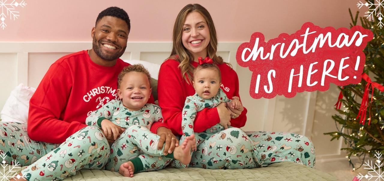 Family of four wearing matching Christmas green and red pajamas.