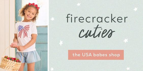 Little girl wearing red white and blue outfit.