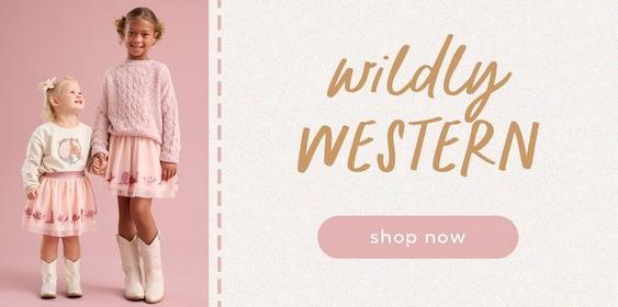 two little girls wearing western themed outfits