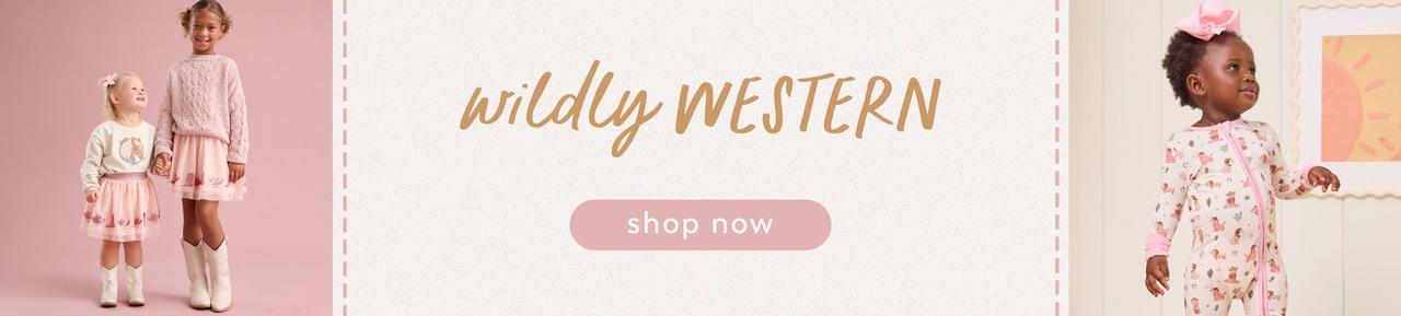 two little girls wearing western themed outfits