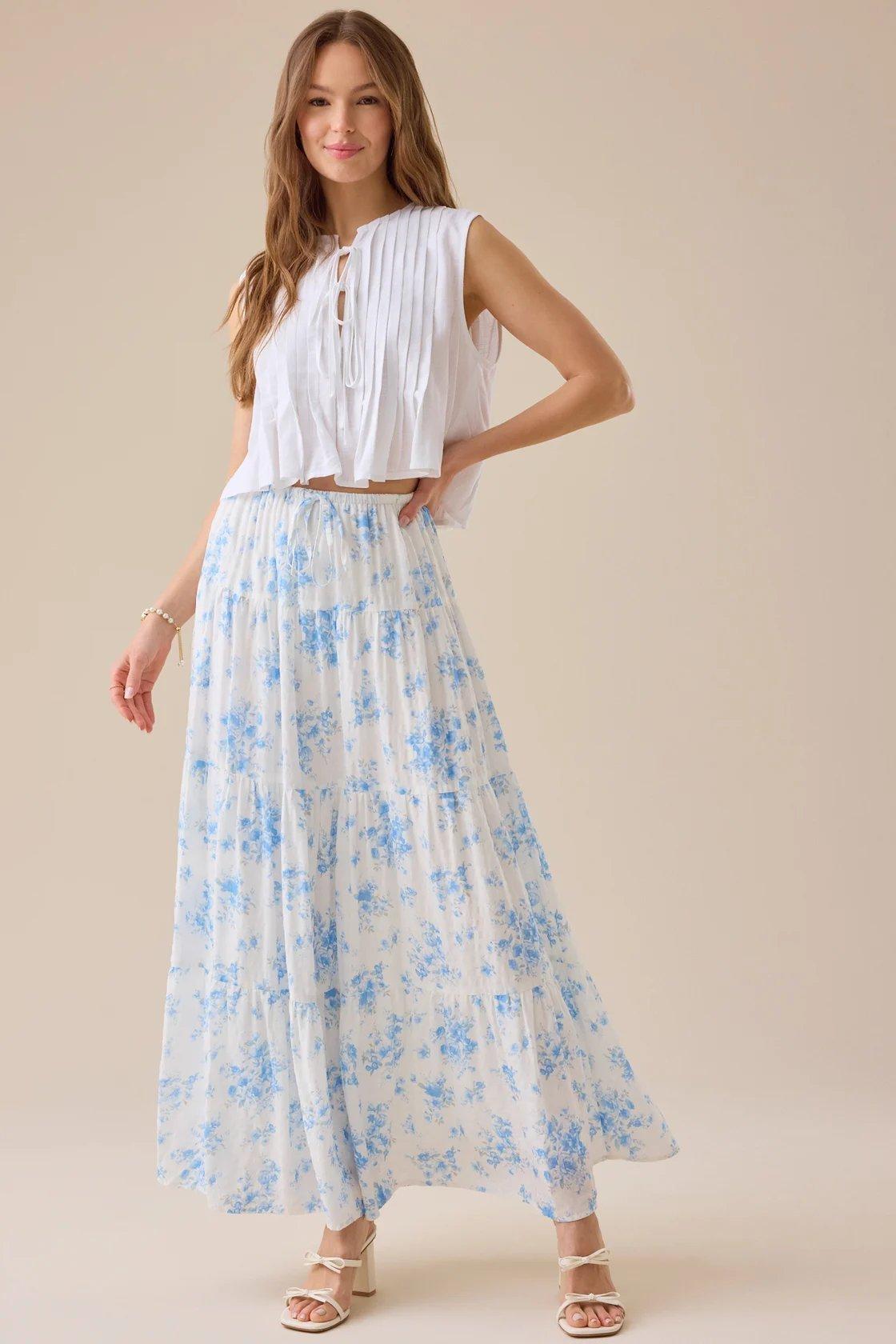girl wearing an ivory and blue floral maxi skirt