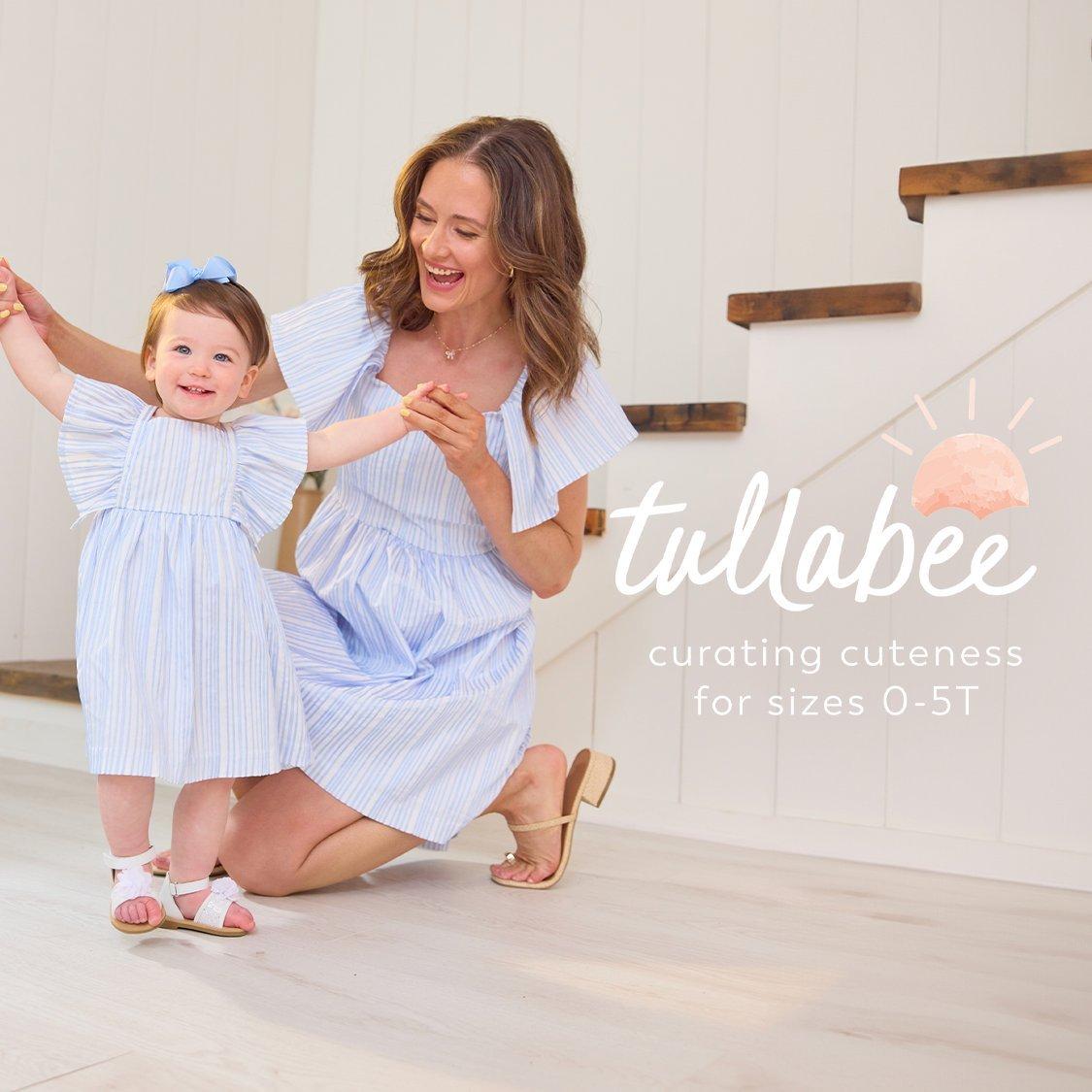mom and daughter wearing coordinating light blue dresses