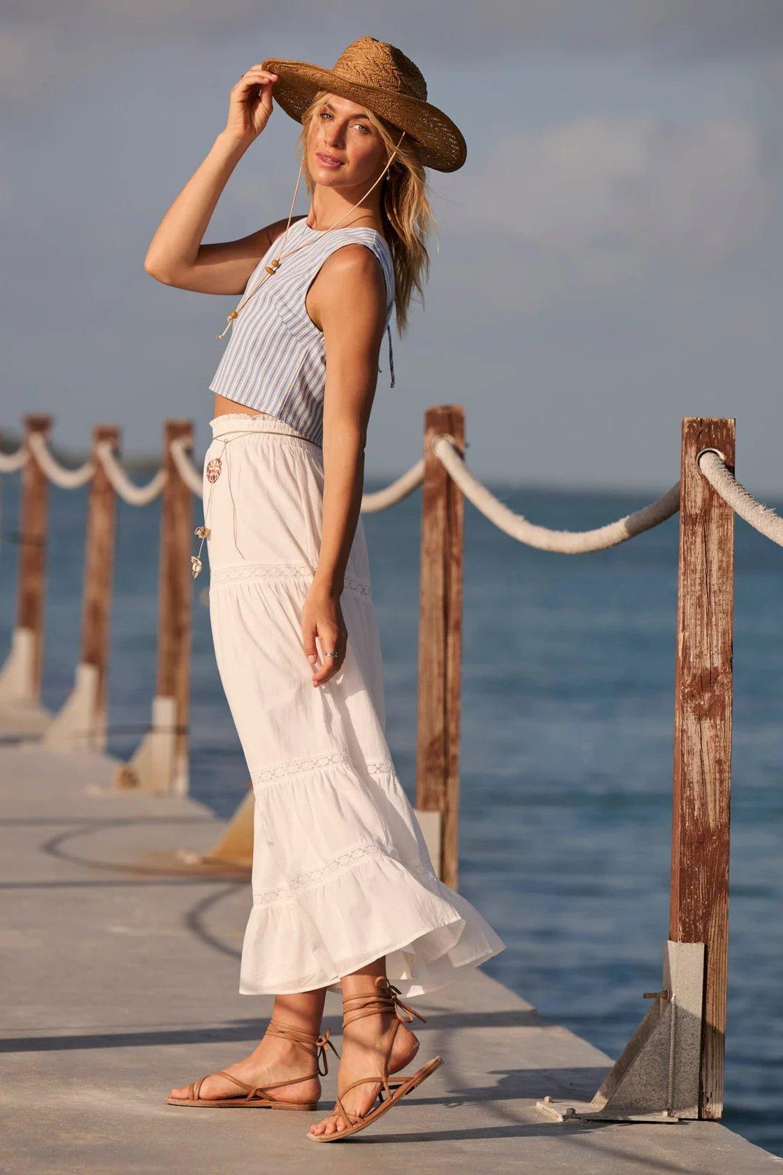 Girl wearing a white maxi skirt