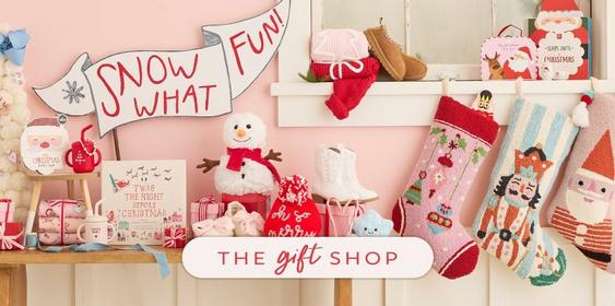 Assorted gifts-pink, red, white, and blue arranged on a shelf.