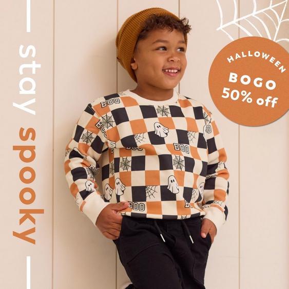 a variety of halloween themed clothing on a young girl, baby boy, and mama and me style
