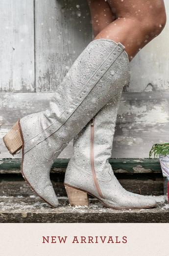 Women wearing sparkly silver cowboy boots