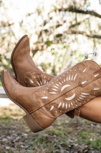 Women wearing brown cowboy boots