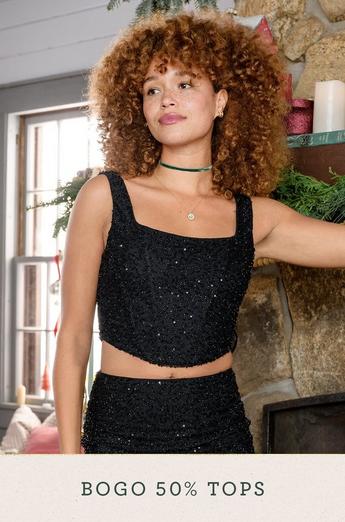 Woman wearing a black sparkly tank