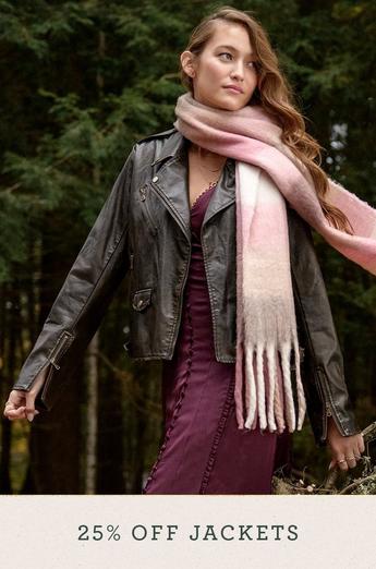 Woman wearing a black leather jacket and pink scarf