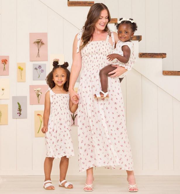 Mama and little girls wearing matching floral dresses