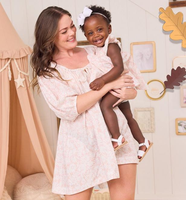 Mama and little girl wearing matching floral dresses