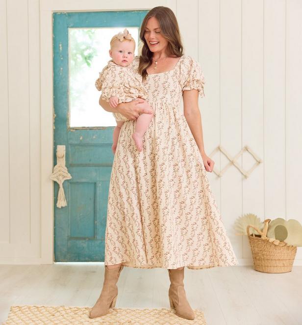 Mama and little girl wearing matching floral dresses