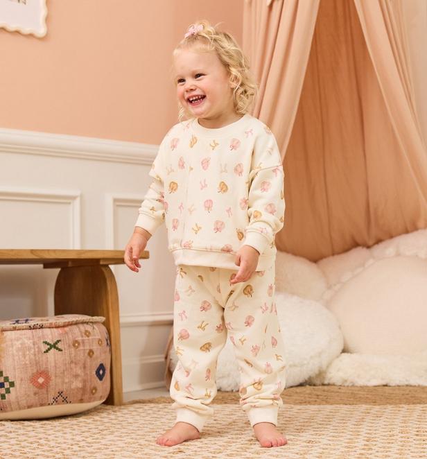 little girl wearing a fall themed matching set