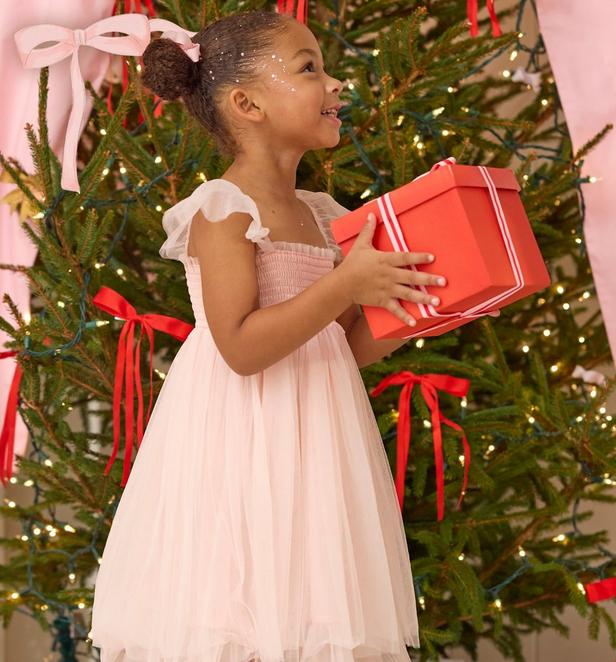 Little girl wearing a light pink dress