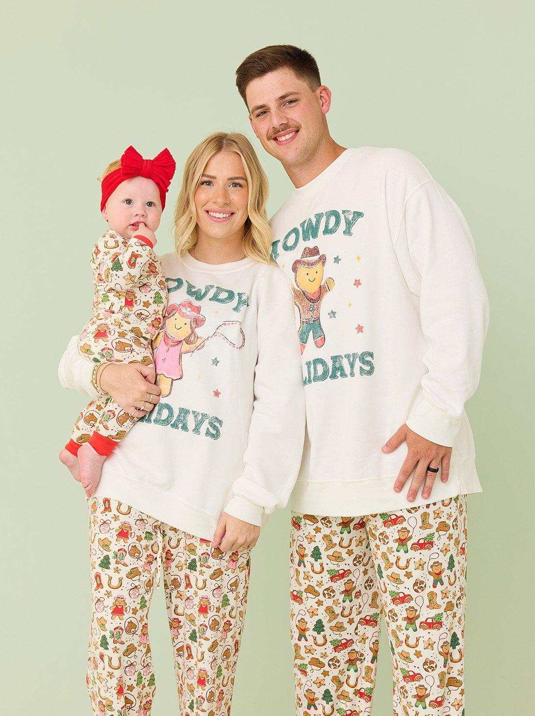 Family wearing matching christmas pajamas