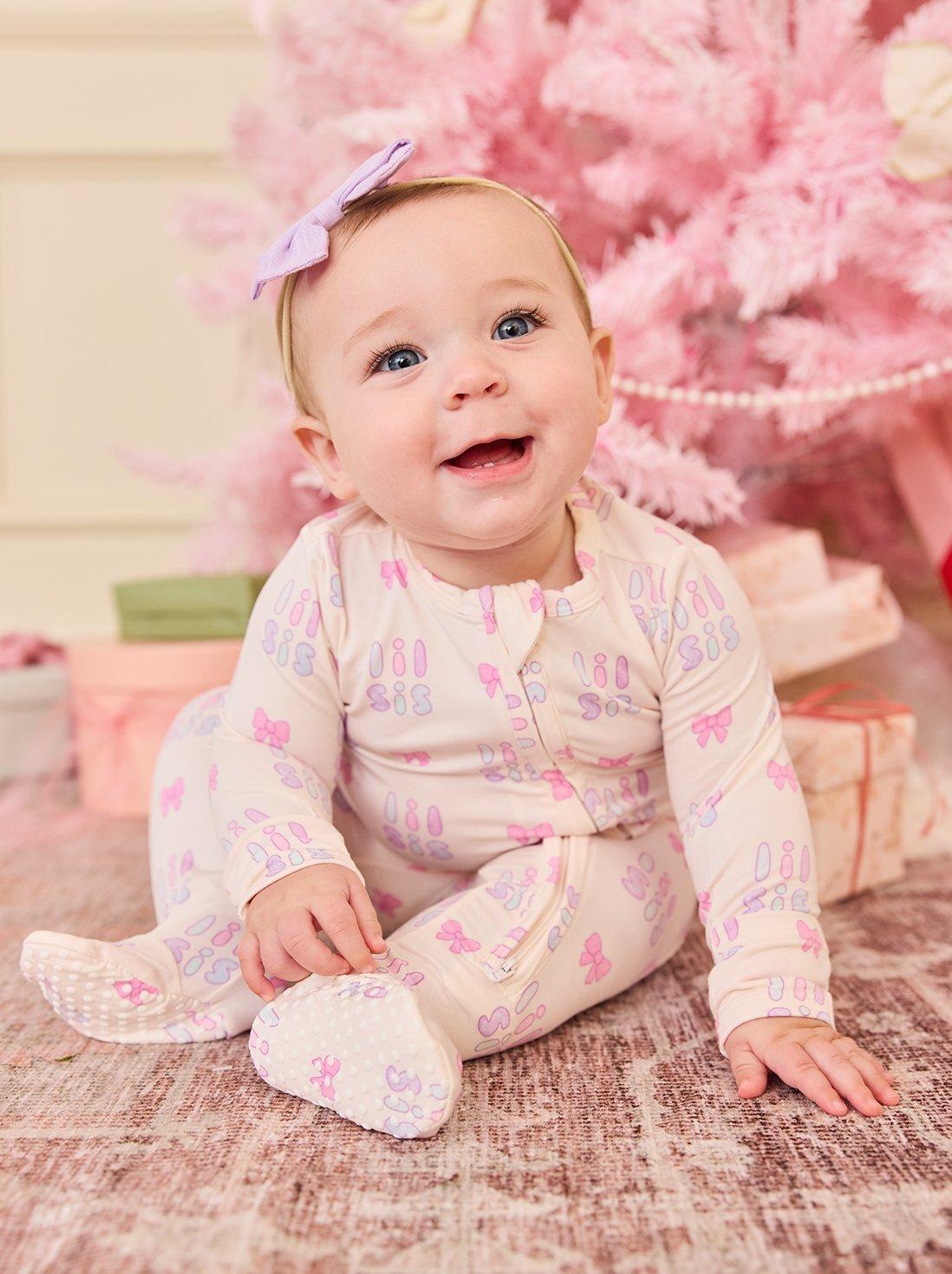 little girl wearing matching christmas themed pajamas