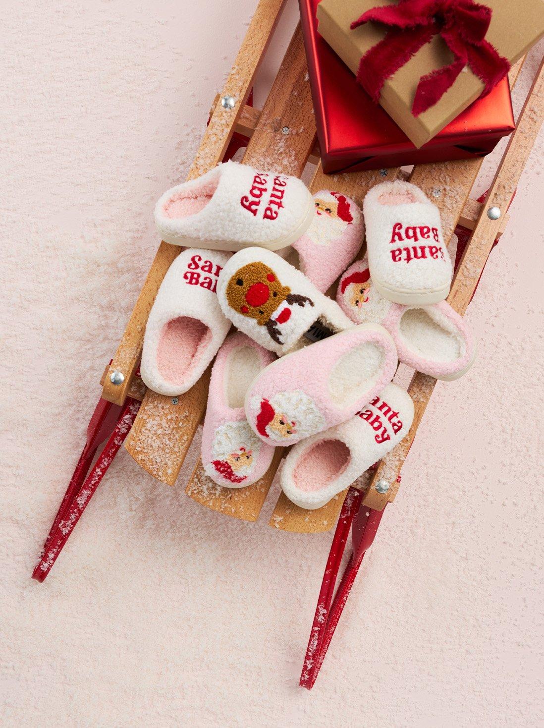 a variety of christmas themed slippers on a sleigh