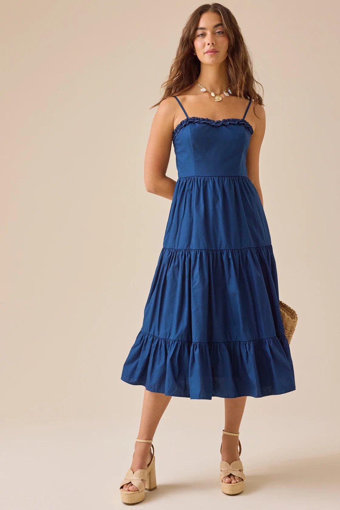 girl wearing a navy blue midi dress