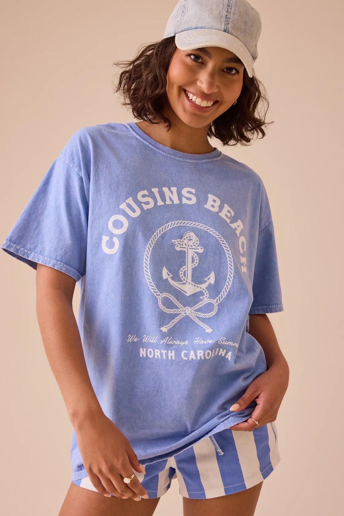 Girl wearing a graphic tee with an anchor pictured