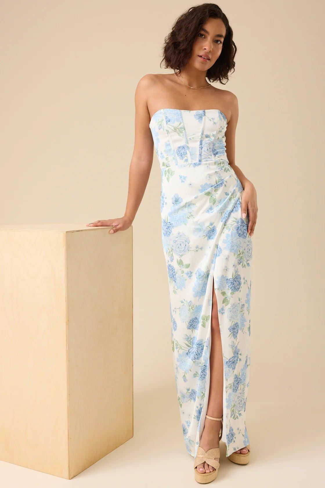 Girl wearing a white strapless maxi dress with blue florals