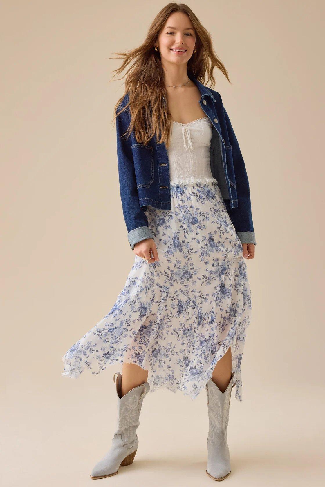 girl wearing an ivory and blue floral maxi skirt