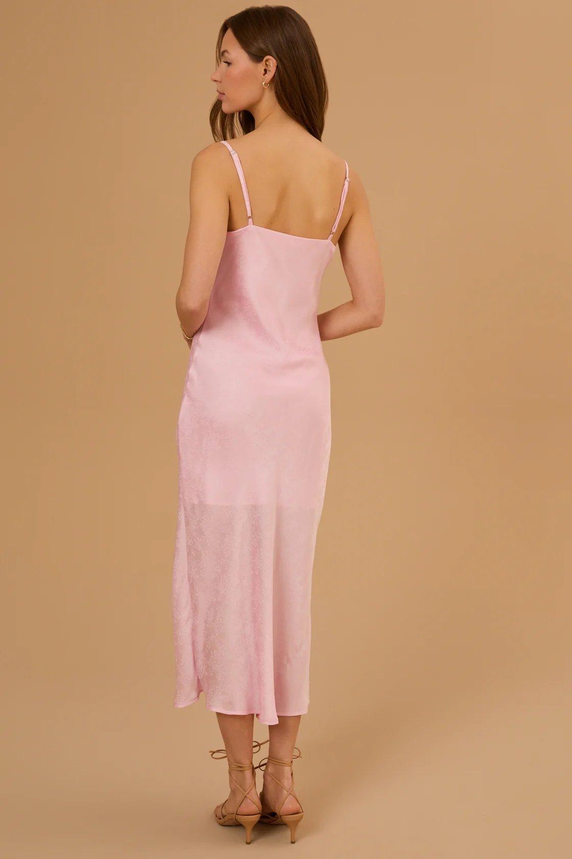 girl wearing a light pink satin midi dress