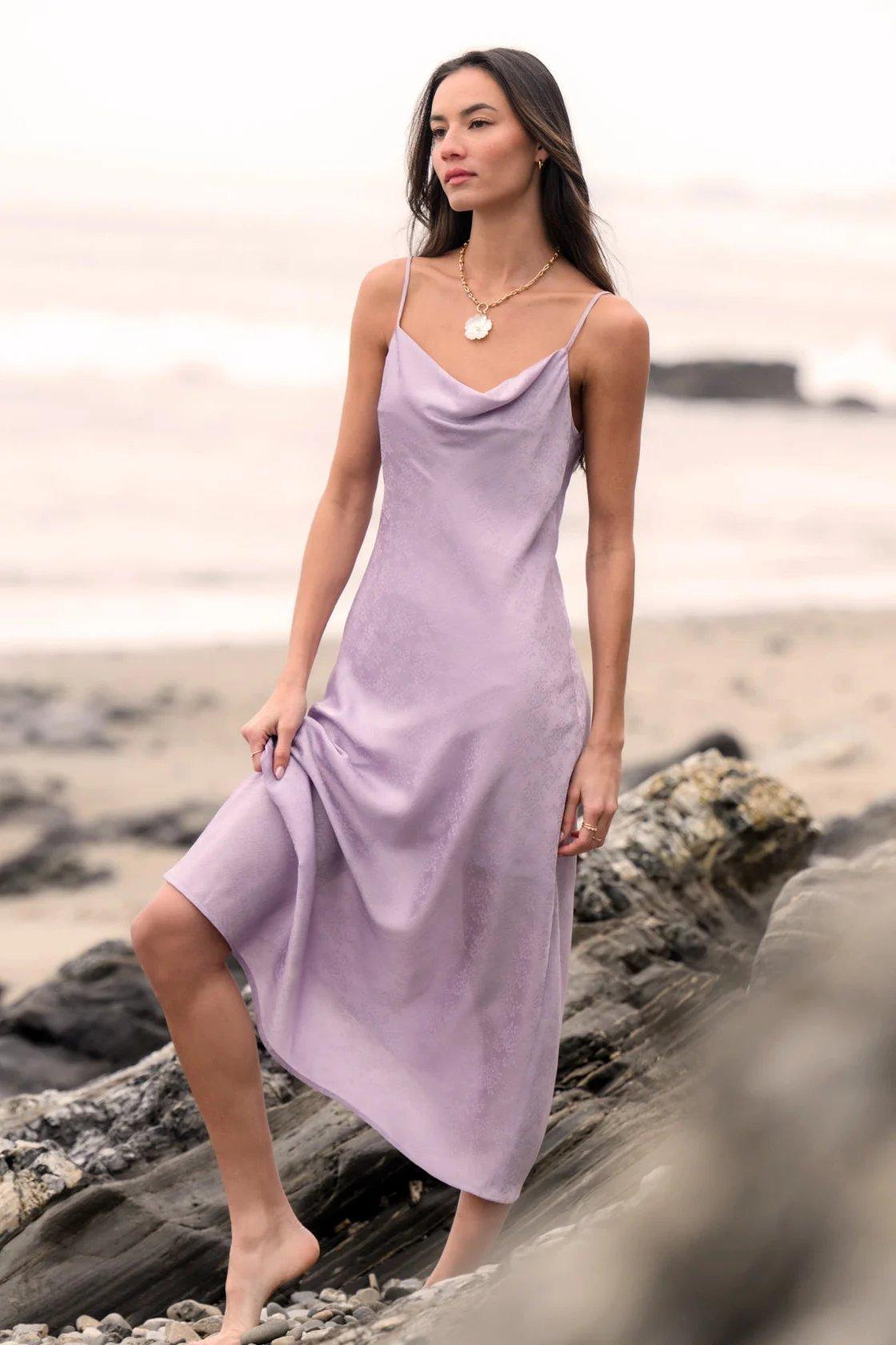 Girl wearing a light purple satin midi dress