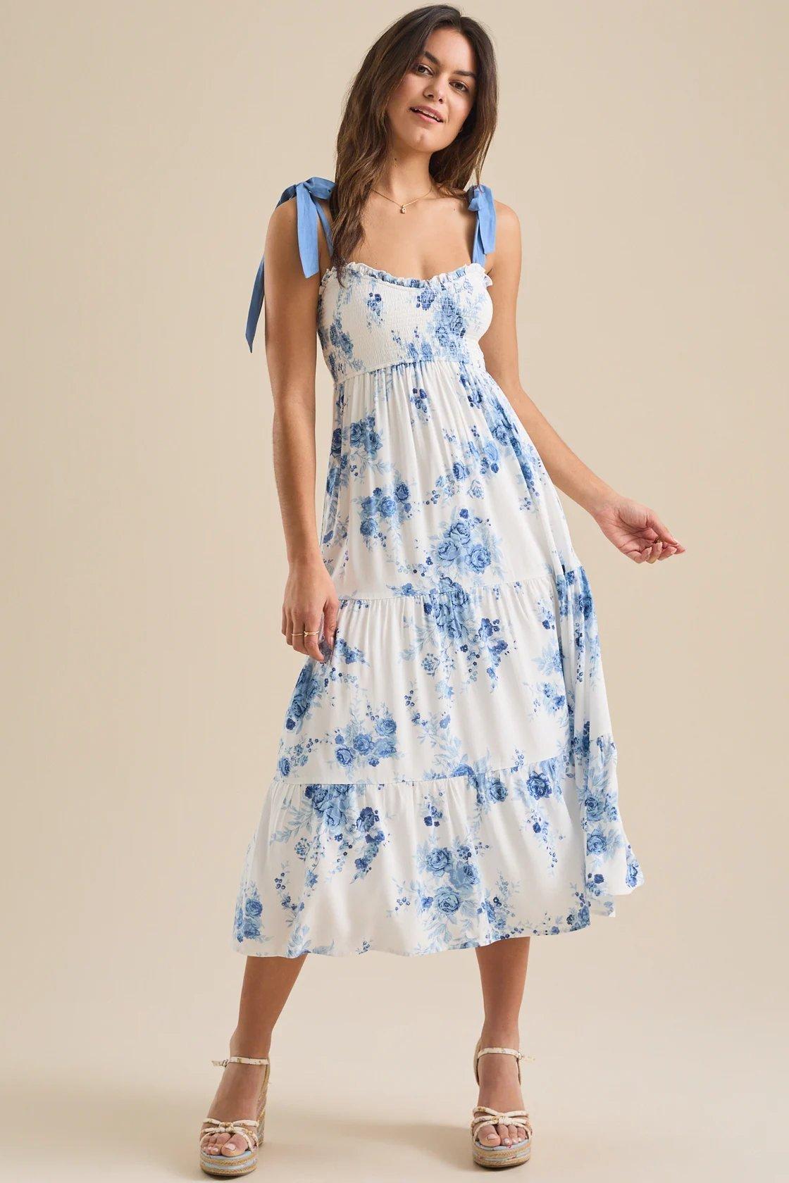 Girl wearing a blue and white floral maxi dress