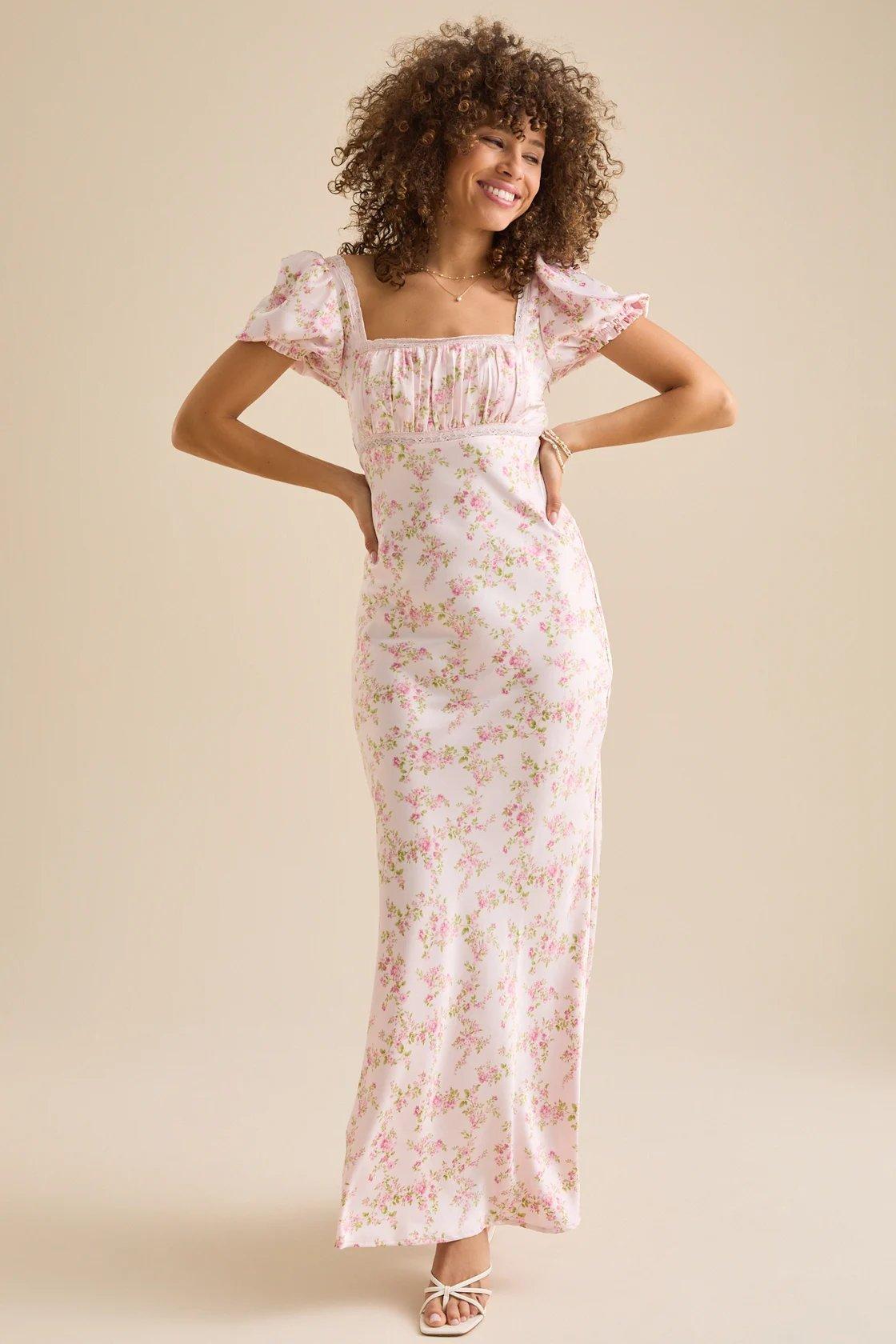 Girl wearing a white and pink floral satin maxi dress