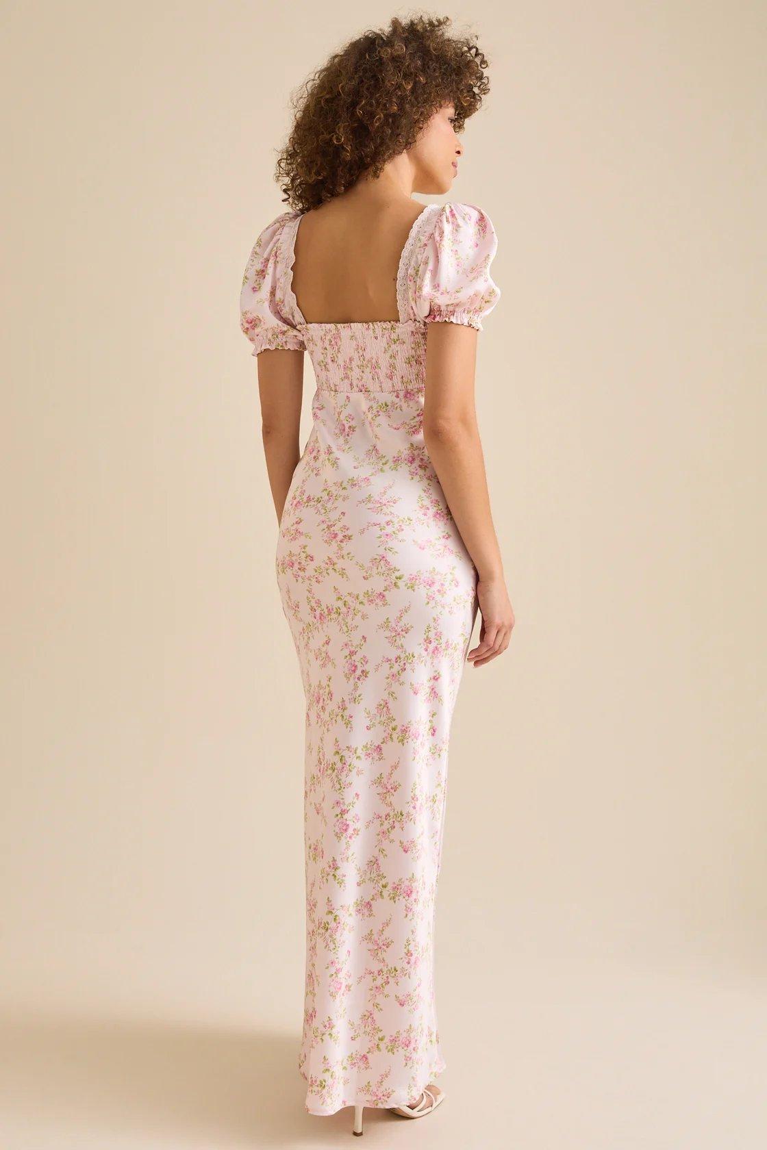 Girl wearing a white and pink floral satin maxi dress