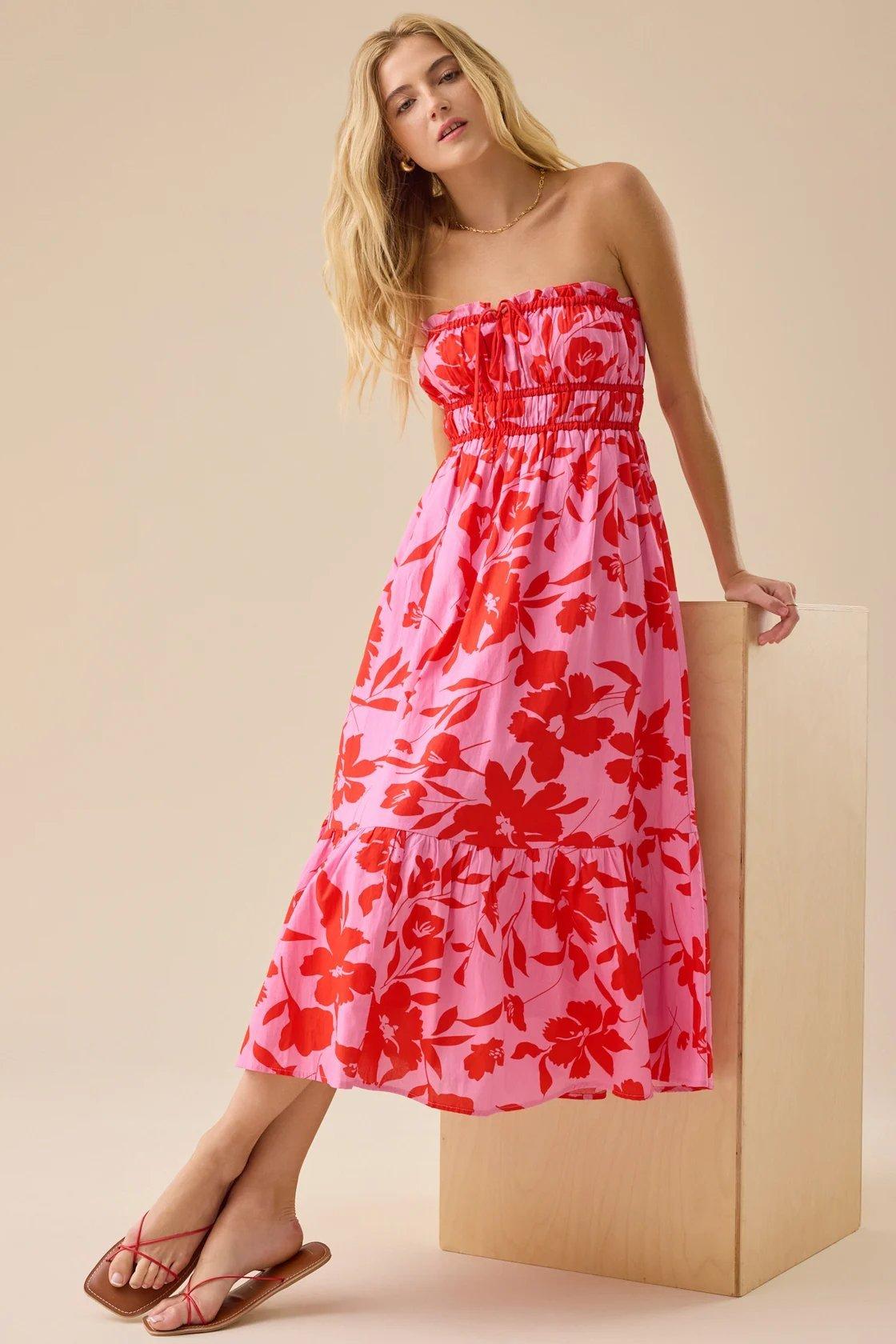 Girl wearing a pink and red floral strapless midi dress