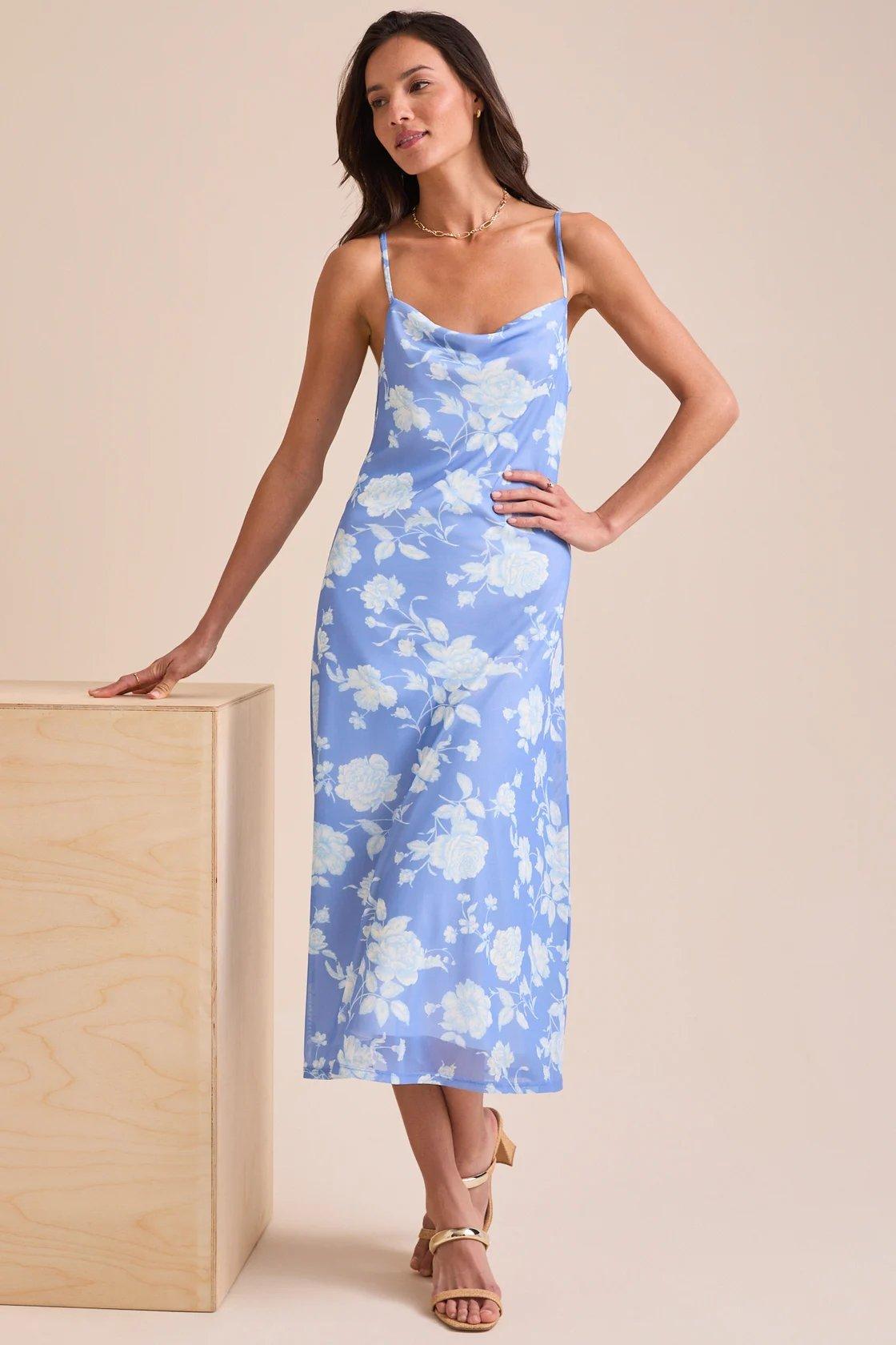 Girl wearing a blue midi dress with light blue flowers