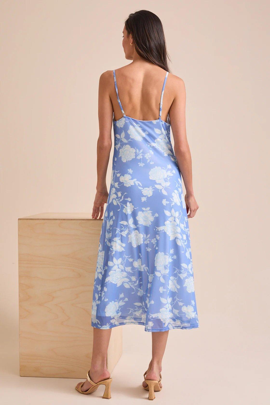 girl wearing a blue midi dress with light blue flowers