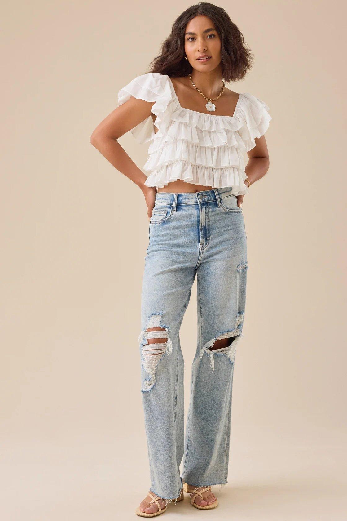 Girl wearing a white ruffle top