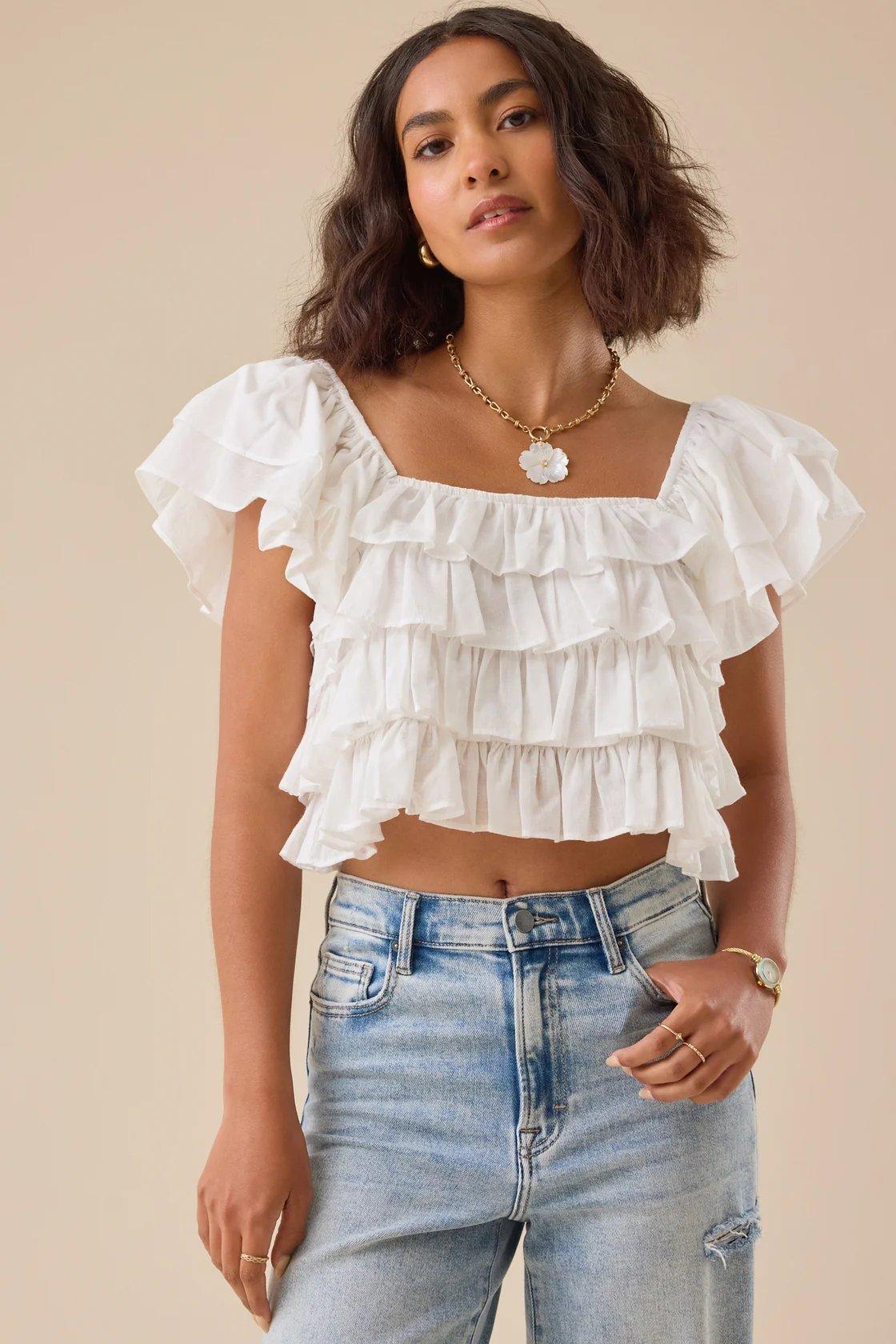 girl wearing a white ruffle top