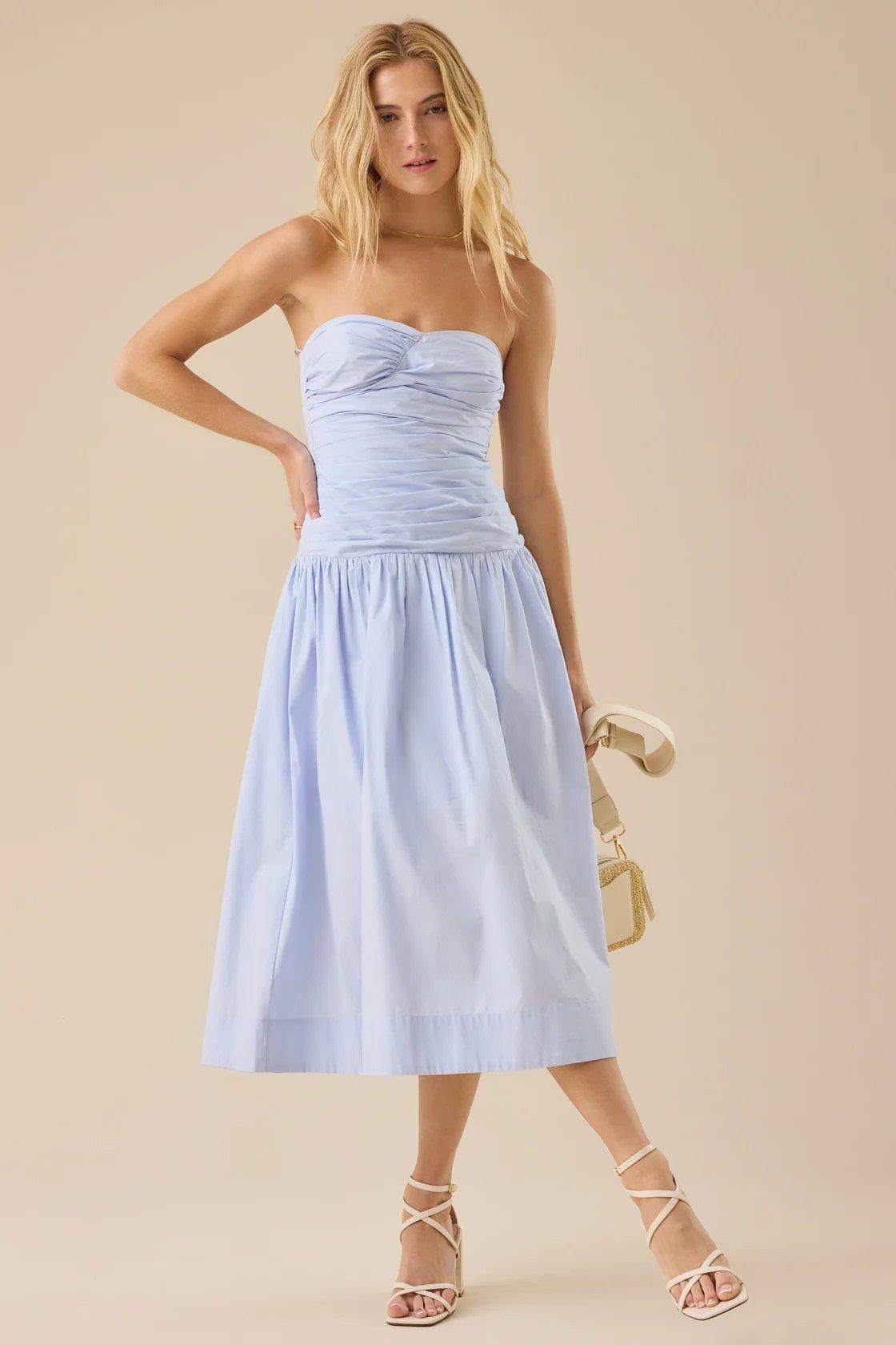 girl wearing a light blue strapless midi dress