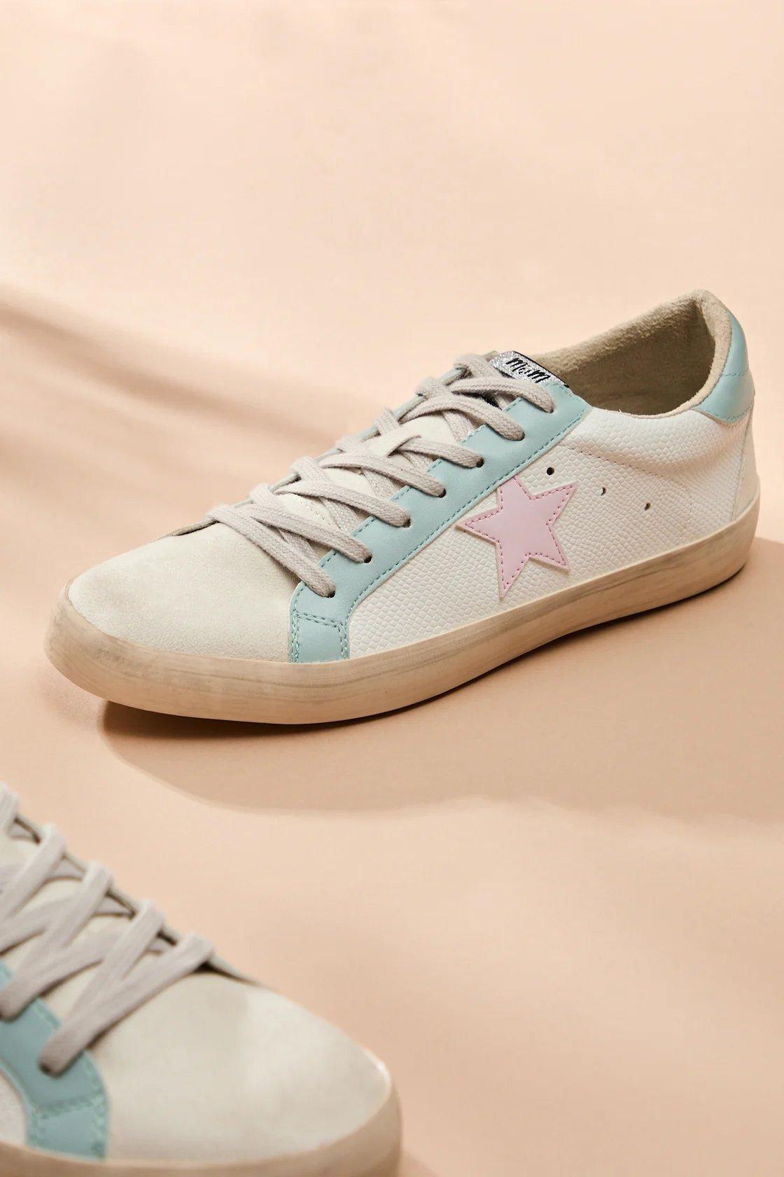 white sneakers with light blue and pink details