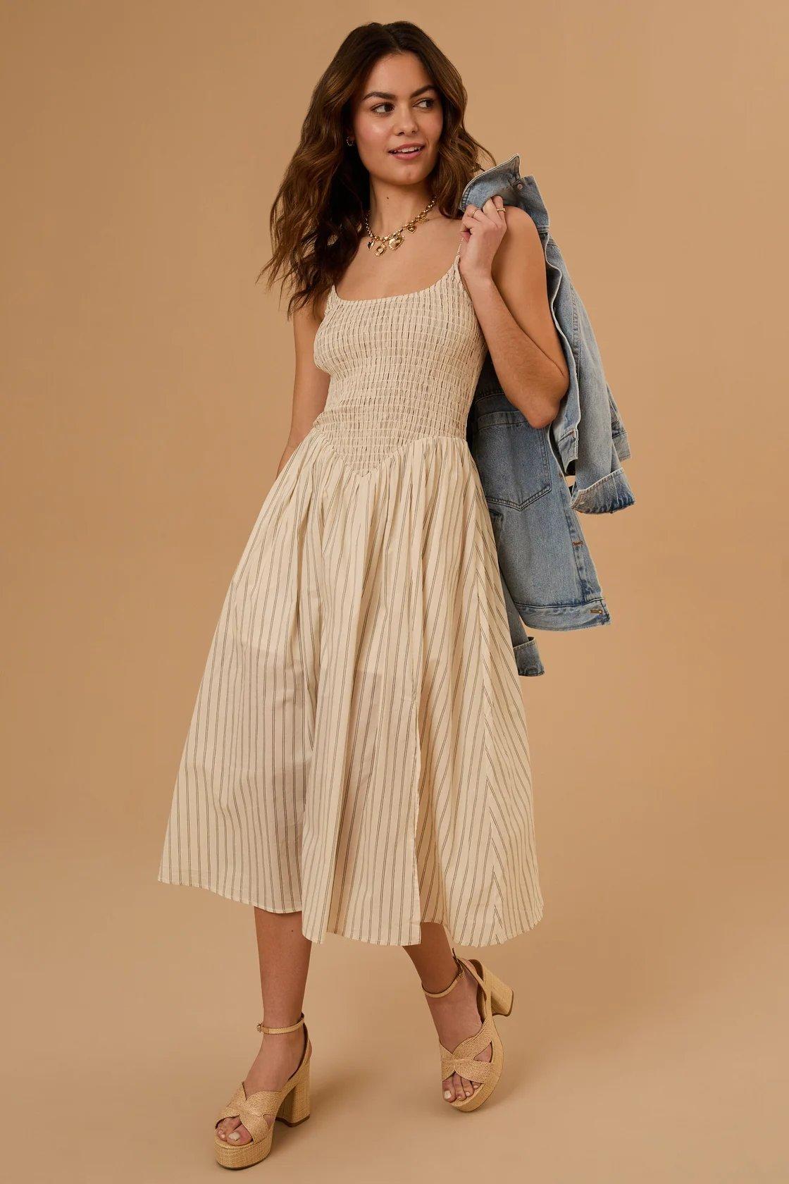 Girl wearing a tan midi dress