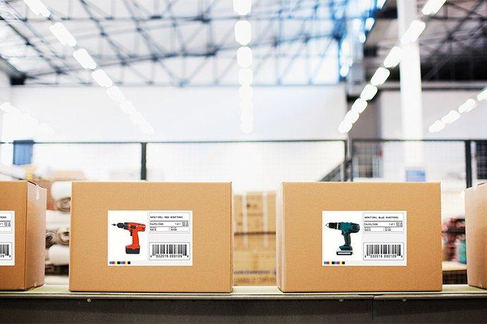 Labelled boxes on a conveyor belt at a production plant