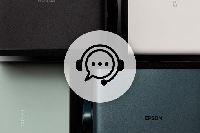 a group of four different colored epson projectors with a headset