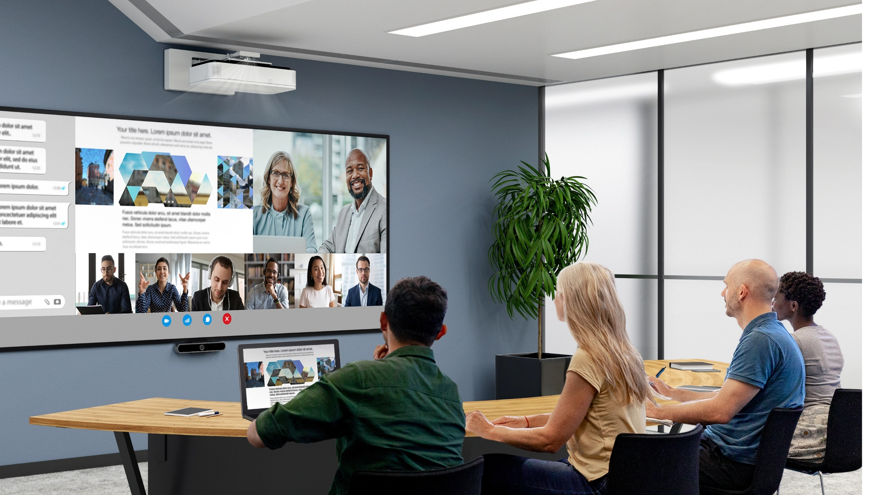 A team of four people sits in a modern conference room, engaging in a video call displayed on a large screen.