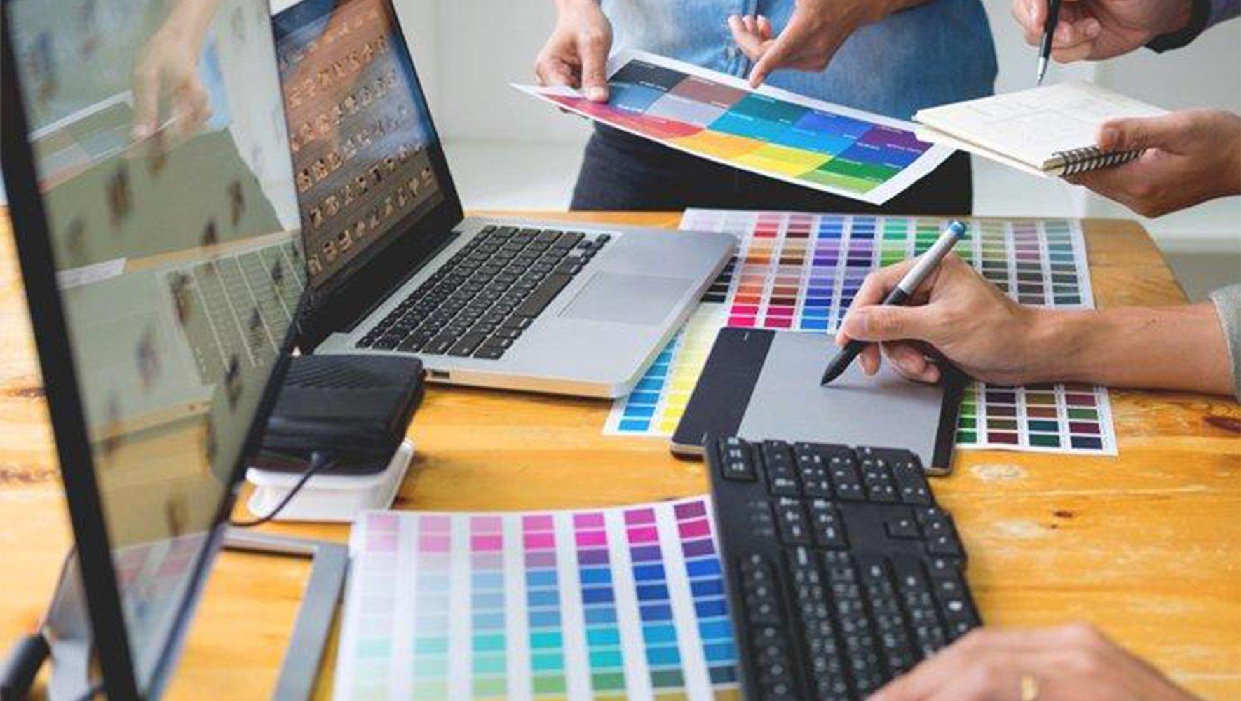 Laptops and sheets with color color palettes