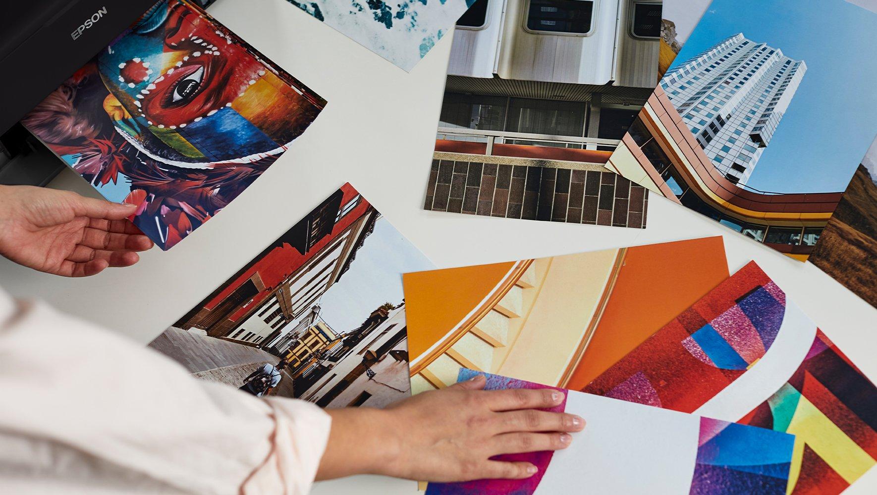 Two hands choosing between different images.