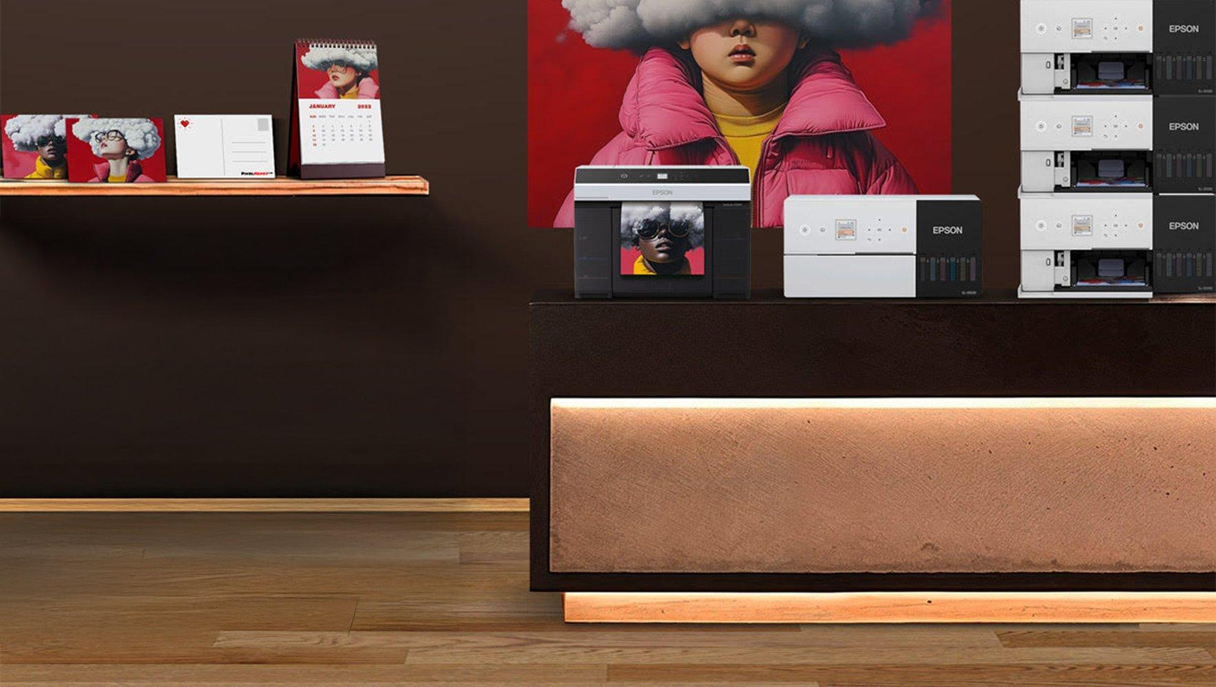 Stacked Epson printers and calendars on a shelf