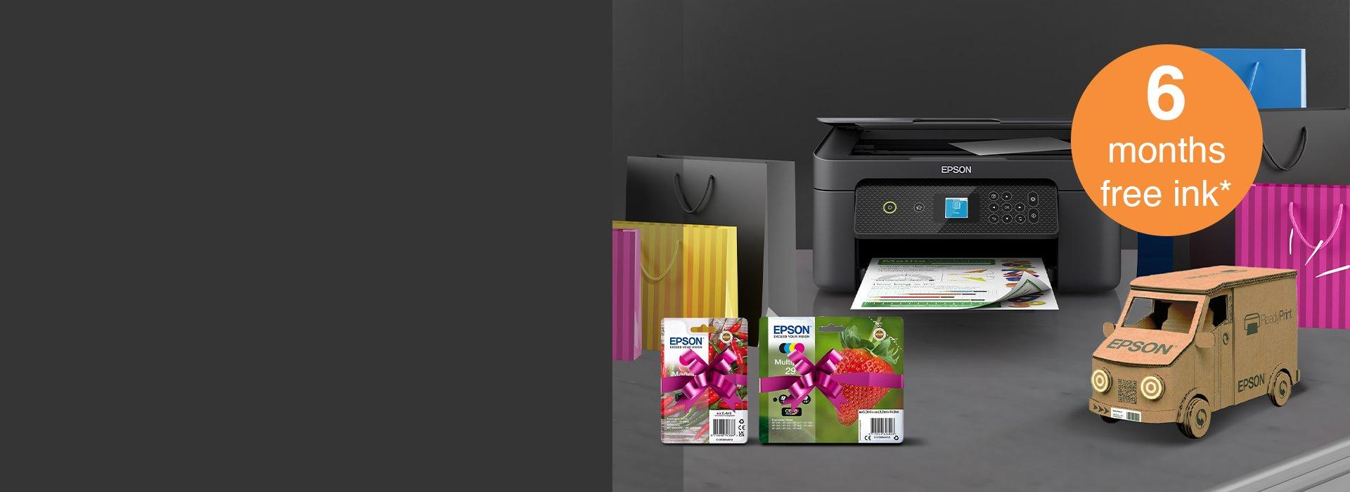 An Epson printer with ink cartridges amid colourful paper bags and a paper truck 