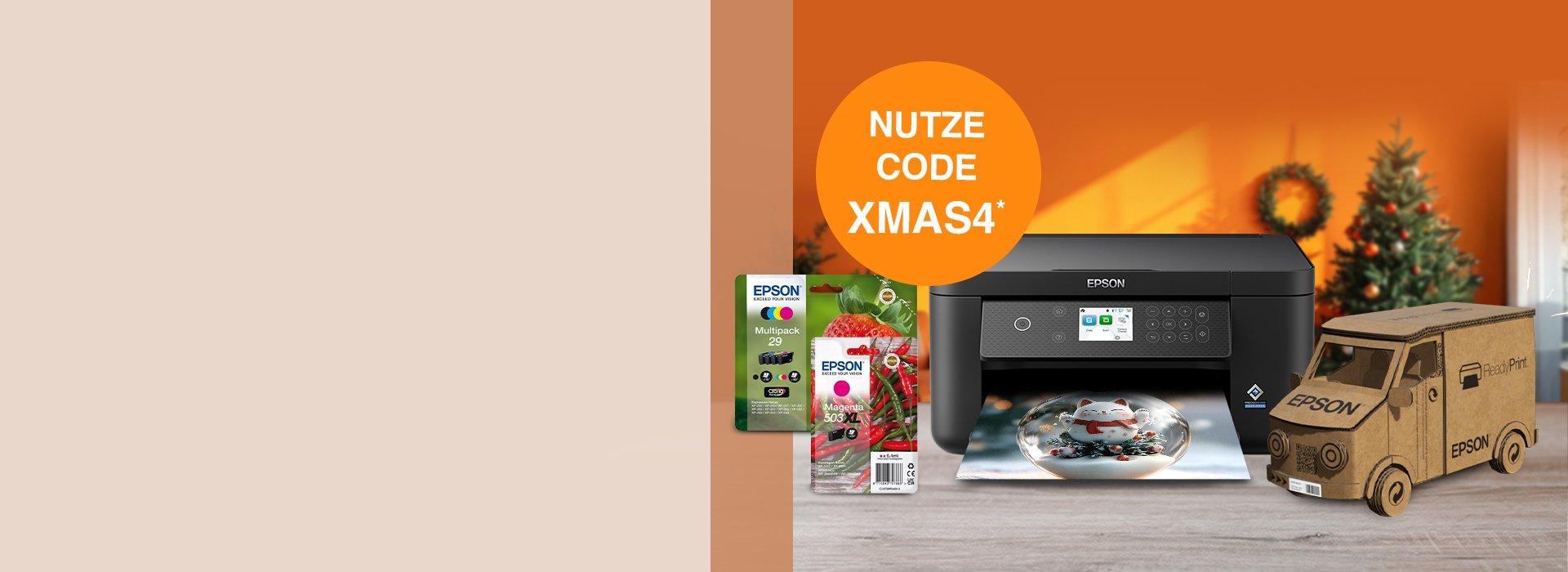 An Epson printer with cartridge inks, a cardboard truck with the Epson logo, against an orange background with a wreath and Christmas tree