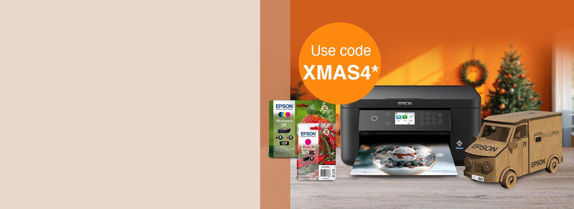 An Epson printer with cartridge inks, a cardboard truck with the Epson logo, against an orange background with a wreath and Christmas tree