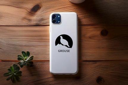 A smartphone with a white case featuring a black silhouette of a grouse and the word "GROUSE".