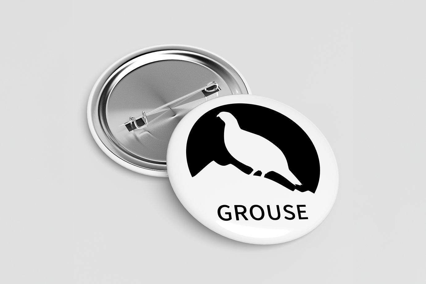 Two round badges are shown; one face up with a black silhouette of a grouse and the word "GROUSE".